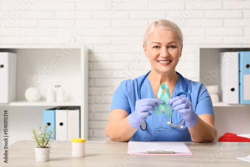 Mature female doctor with t...