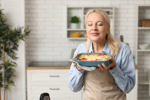 Beautiful mature woman hold...