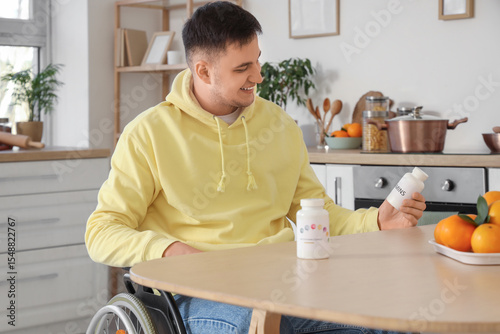 Young man in wheelchair wit...
