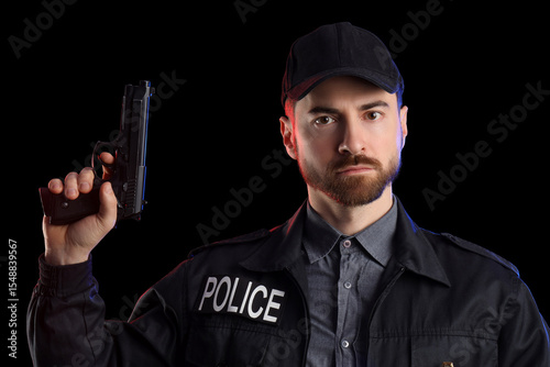 Male police officer with gu...