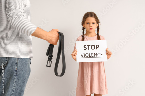 Sad girl holding paper with...