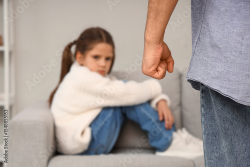 Angry father with his daugh...