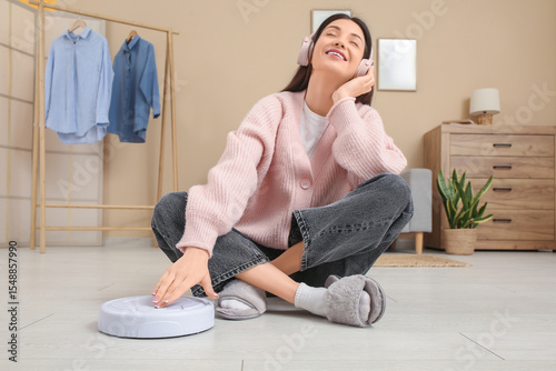 Relaxed woman enjoying musi...