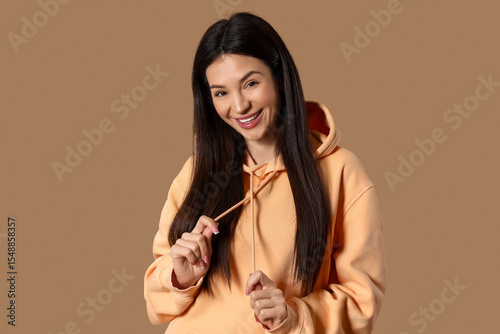 Smiling young woman in peac...