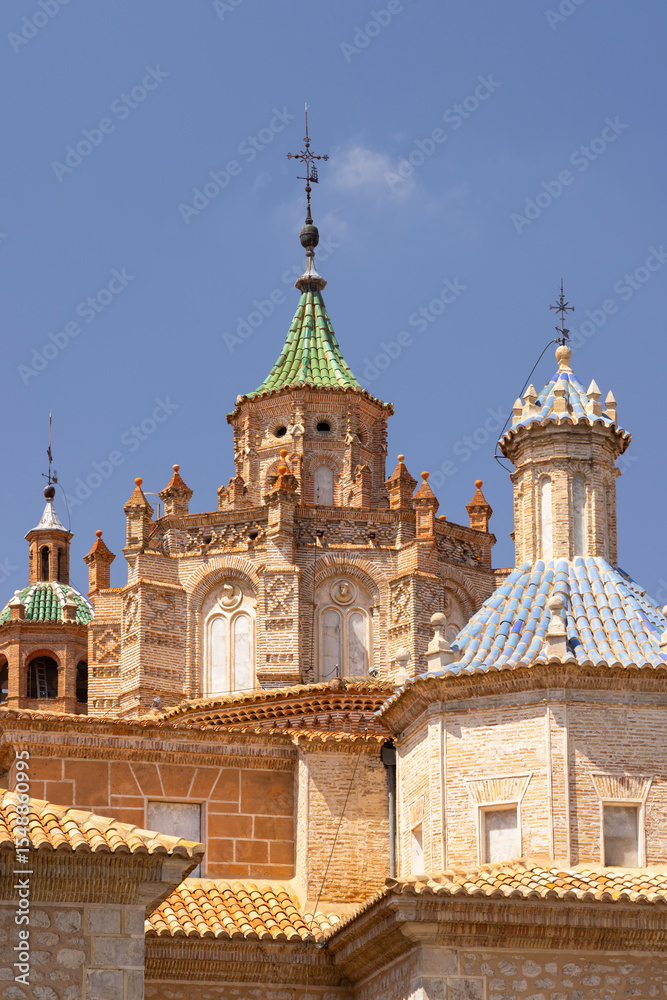 Obraz premium Cathedral of Teruel showing colorful tiled domes and brick walls in Aragon, Spain