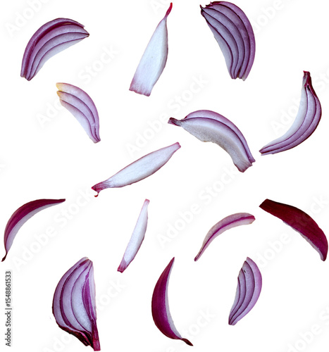 A collection of red onion slices scattered against a white background, showcasing their vibrant colors and textures.