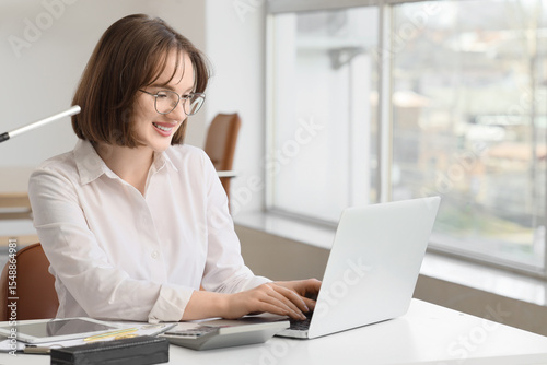 Young businesswoman working...