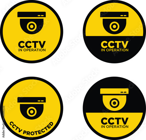 Set of four CCTV security camera sign in yellow and black. The signs feature the text "CCTV IN OPERATION" and "CCTV PROTECTED" with a CCTV camera icon.