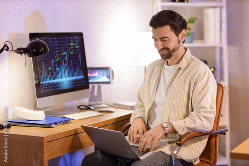 Handsome man working with l...