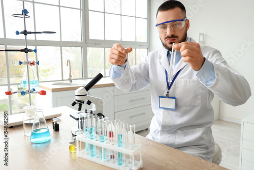 Male scientist with test tu...