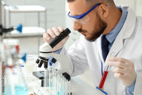 Male scientist with test tu...