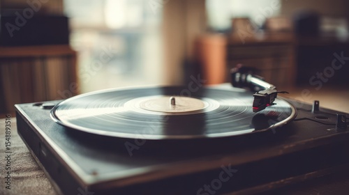 Close-up view of a vintage turntable playing a record.