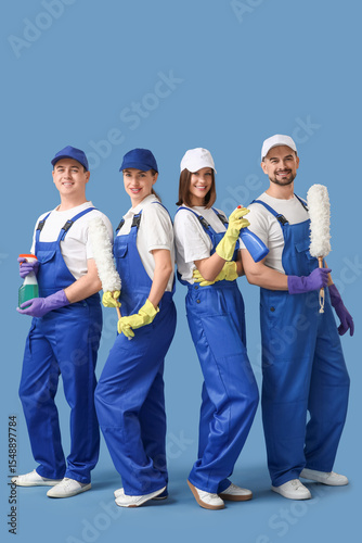 Team of young janitors with...