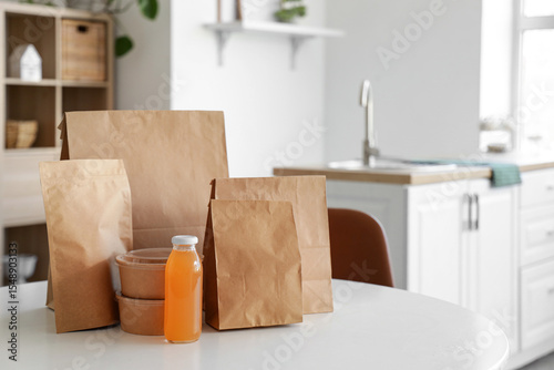 Paper bags with juice on ta...