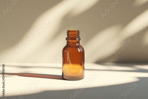 Amber glass bottle with no lid, is standing under the aesthetic plant shadows. Showcase beauty products, medicine, or natural, herbal and aromatherapy items.