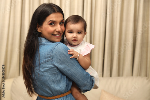 Close up of happy young indian mother hug cuddle little infant or toddle. motherhood, childcare concept. Concept : Happy Mothers Day