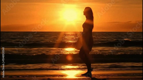 woman on the beach at sunset