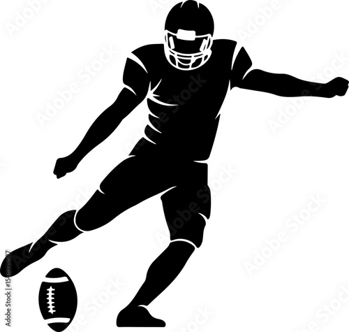 Silhouetted American Football Player Kicking the Ball