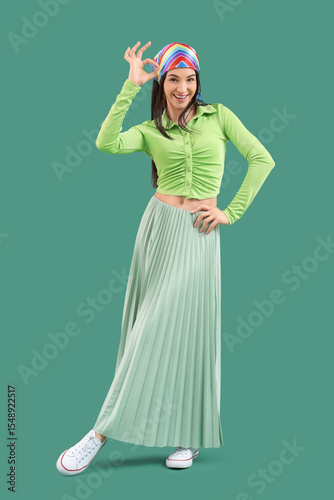 Stylish young woman showing...