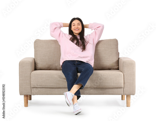 Young woman resting on grey...