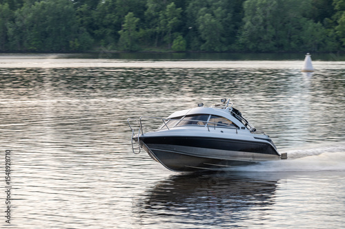 Motor boat goes fast on water.