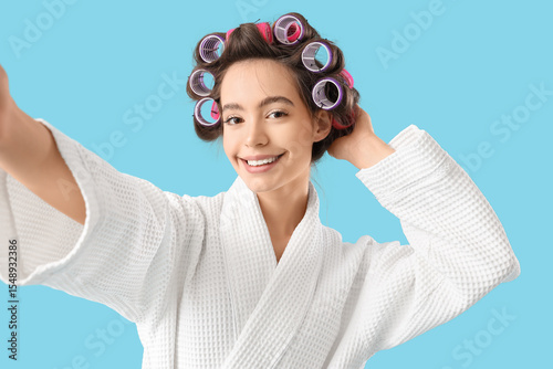 Young woman in bathrobe wit...