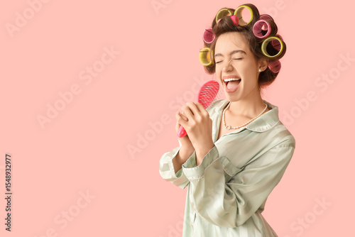 Young woman in pajamas with...