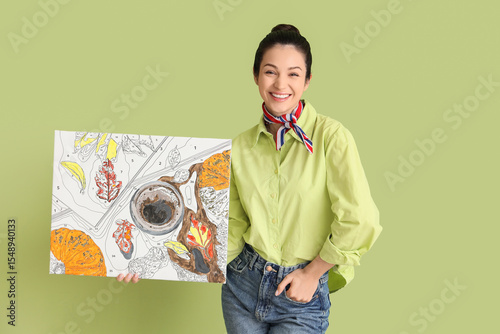 Smiling woman holding paint...