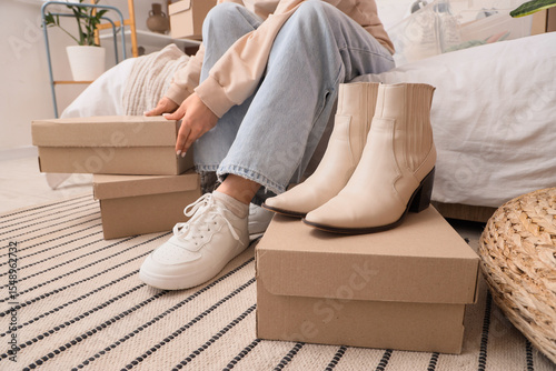 Woman with shoe boxes and b...