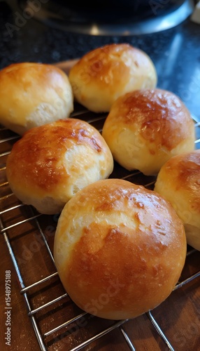 Freshly baked sweet buns with a slightly misshapen golden crust