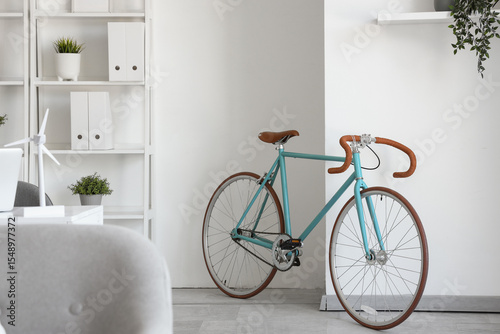 Modern bicycle in light hom...
