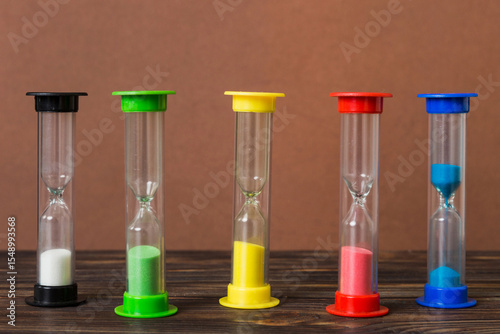 hourglass on the table, sand clock as time passing concept for business deadline, copy space