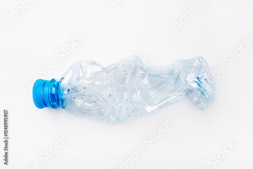 Crumpled empty plastic bottle on a white background