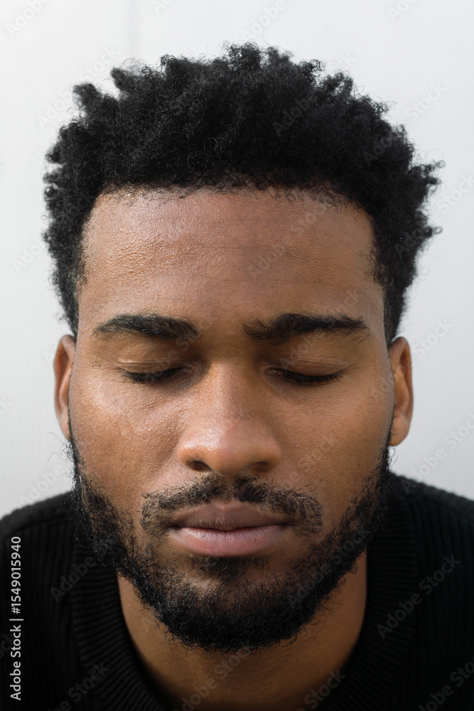 Obraz premium Portrait of a handsome young man on a minimalistic background