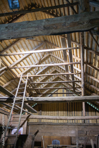 A wooden building with a ladder on the side