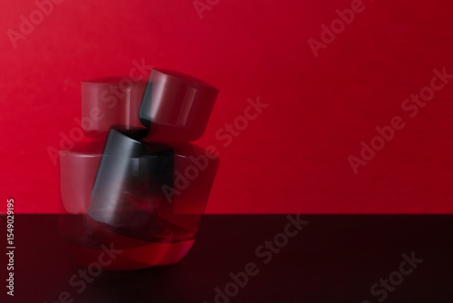 Bold red perfume bottle with motion blur, conveying luxury, sensuality, and movement. A visually striking concept in fragrance, glamour, and high-end beauty branding.