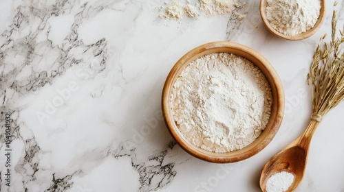 Top view of flour with spoon and wheat on marble for baking ingredient food rustic background scene