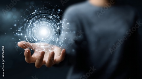 A man holding a glowing digital circle in his hand, surrounded by futuristic technology and connection lines, symbolizing the integration of AI into a business vision or creative process.