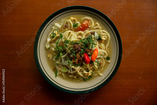 Obraz na płótnie Mie godog Jawa or bakmi jawa or java noodle or Mie rebus or boiled noodles with spoon and fork
