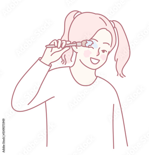 A cheerful child is playfully brushing her teeth with a colorful toothbrush, promoting good dental hygiene