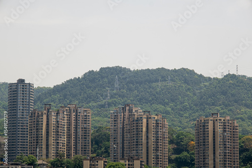 modern apartment building with balconies and laundry drying in Chongqing, China photo