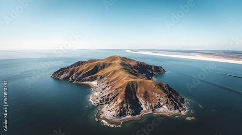 Rocky island and narrow sand bar leading to the mainland