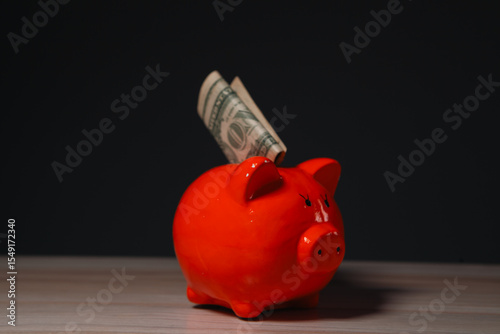 money and piggy bank on the table