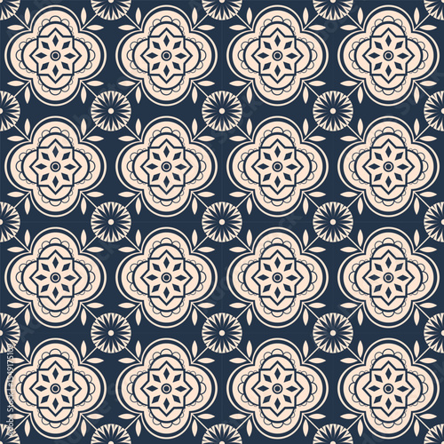 A seamless geometric abstract floral pattern featuring intricate light beige quatrefoil and circular motifs on a dark blue background. Perfect for textiles, wallpapers, packaging, and digital designs.