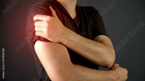 Wallpaper Mural Close up hands touching shoulder pain Massaging and Stretching Back to Ease Injury Rubbing the Pain Away with red light Torontodigital.ca