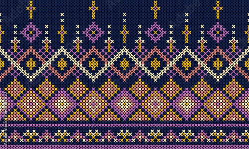 Multi-colored decorative patterns fill the background in geometric shapes through embroidery.