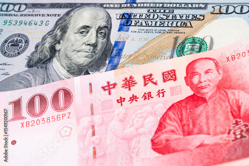 Wallpaper Mural 100 US dollar and 100 New Taiwan dollar banknotes. International trade concept Torontodigital.ca