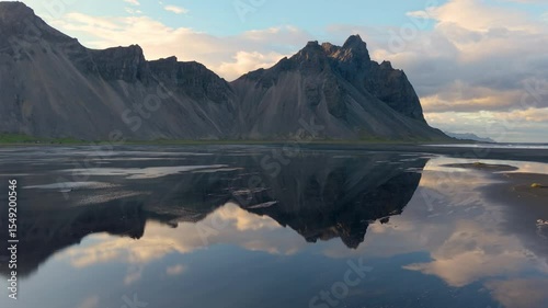  The aerial view of Mountains and Expansive, Lush Green Dyunes Nearby. Stokksnes. Iceland