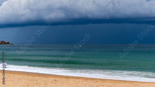 Stormy skies over a tranquil shoreline