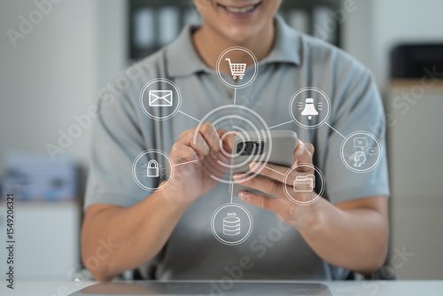 Businessman using smartphone with application notification icon.